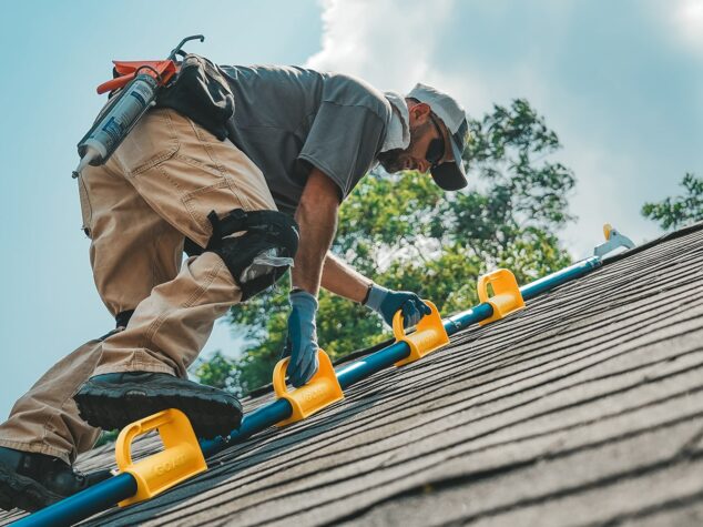 Complete Pest Solutions Employee climbing roof {{brizy_dc_image_alt entityId=